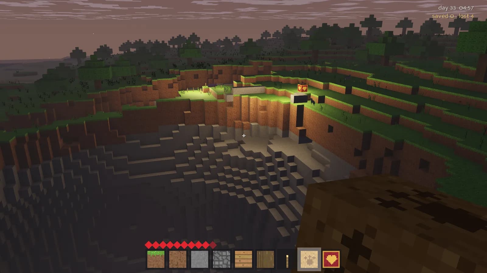 A lit sanctuary banner above a deep quarry dug into grassy hillside before dawn