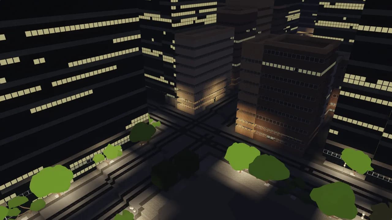Office towers at night seen from above, windows lit in broken rows over lamplit streets and trees