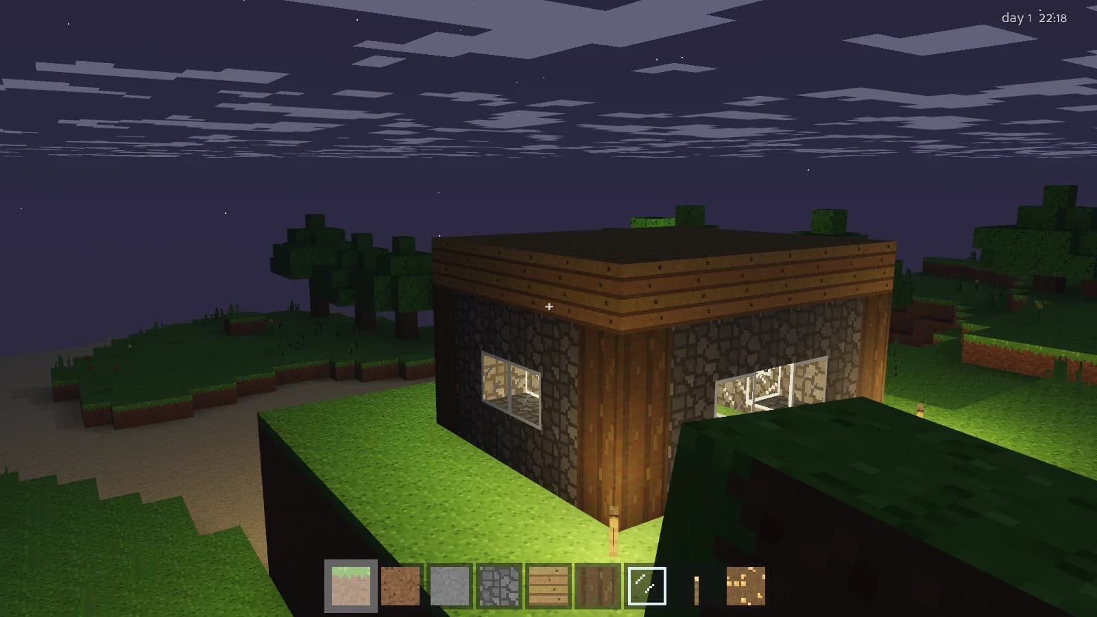A stone and timber cottage at night, windows glowing under a star field